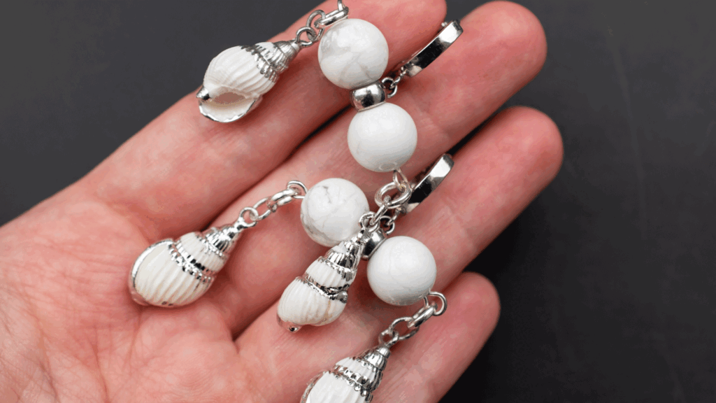 Girl holding White Pearl studs