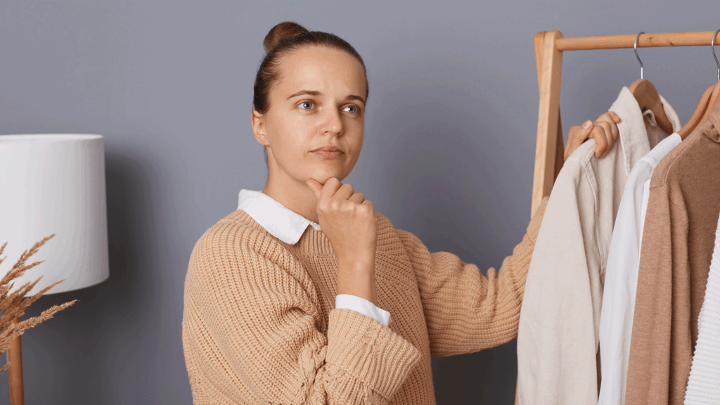 Girl Thinking Before Picking The Right Dress
